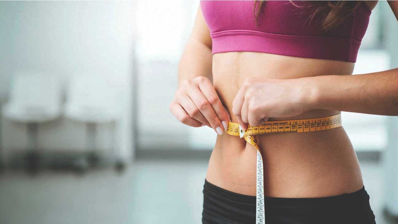 Woman-Measuring-Stomach