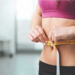 Woman-Measuring-Stomach